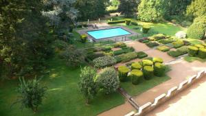 an aerial view of a garden with a swimming pool at Château de Busset in Busset