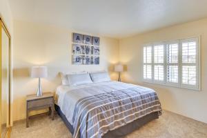 a bedroom with a bed and a window at Bright Tucson Home with Patio By Rillito River Path! in Tucson