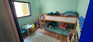 En eller flere senge i et værelse på Maison bord de mer