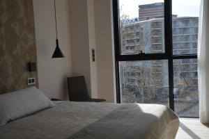 Łóżko lub łóżka w pokoju w obiekcie Hotel Bilbao Plaza