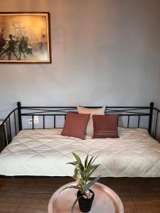 a bedroom with a large bed with a table at Azure Loft in Rodhiá