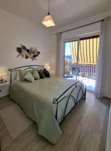 Postel nebo postele na pokoji v ubytování Le Mimose Terrace