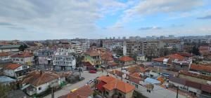 a view of a city with houses and buildings at Панорама in Dobrich