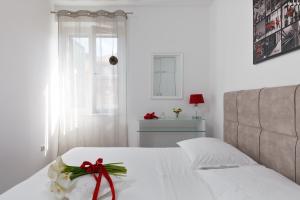 Ein Bett oder Betten in einem Zimmer der Unterkunft Apartments Kala & Kaleta