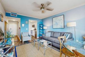 a living room with a couch and a table at Shipwatch 2373 in Kiawah Island