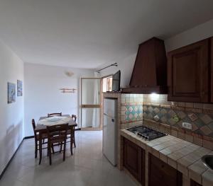 Η κουζίνα ή μικρή κουζίνα στο Residence Punta Sottile Lampedusa 150 mt dalla spiaggia cala francese +33 φωτογραφίες