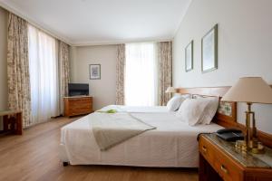TV a/nebo společenská místnost v ubytování Hotel Universal