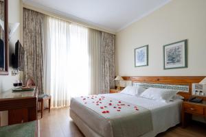 Postel nebo postele na pokoji v ubytování Hotel Universal + 37 fotografií