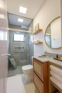 a bathroom with a shower and a toilet and a sink at Apto Novo e diferenciado a 500 metros do Alles Park in Pomerode +34 photos