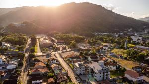 an aerial view of a small town in front of a mountain at Apto Novo e diferenciado a 500 metros do Alles Park in Pomerode