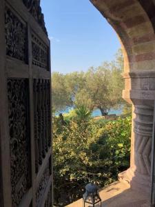 an archway with a view of a garden from a building at Dream House by the Aegean Coast in Dikili +44 photos