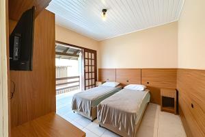 Postel nebo postele na pokoji v ubytování Condomínio Jardins