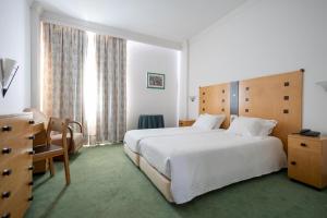Postel nebo postele na pokoji v ubytování Hotel Das Termas + 21 fotografií