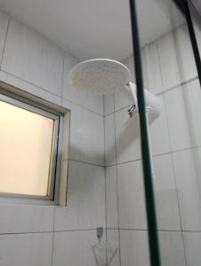 a shower with a shower head in a bathroom at Apartamento da Jack in Campina Grande +27 photos