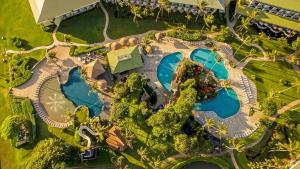 an overhead view of a resort with two swimming pools at Mountain View, 4 Star Beachfront Resort, Lanai, AC, Pool, Restaurant, Gym, Spa in Lihue