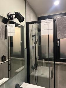 a bathroom with a shower with a glass door at Pozzuoli B&B exSofer in Pozzuoli
