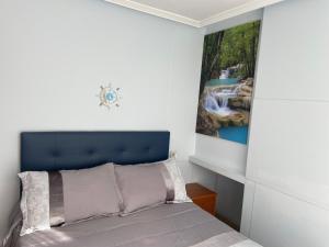 Posteľ alebo postele v izbe v ubytovaní Apartamentos Playa Langosteira