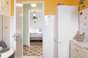 a bathroom with a toilet and a sink at Neoclassical Mansion in Andros Town by Explore Andros in Andros