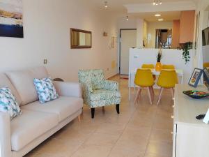 a living room with a couch and chairs and a table at Casa Poris in Poris de Abona
