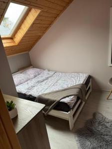 Posteľ alebo postele v izbe v ubytovaní Lawendowe Domki