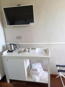TV a/nebo společenská místnost v ubytování Agriturismo La Quercia