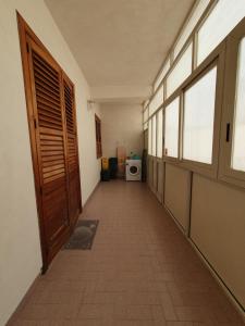 an empty hallway of a room with a door at A casa di Picci in Avola