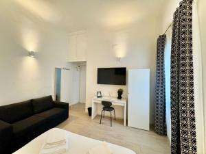 TV a/nebo společenská místnost v ubytování Florence Apartment 10 min dal centro-50 mt tram