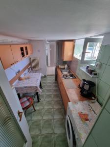 a small kitchen with a sink and a stove at MRI Residence in Cluj-Napoca +10 photos