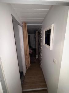 a hallway with a hallway leading to a room with a hallway at Charmant T1 au calme in Cernay