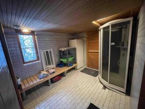 a bathroom with a walk in shower and a sink at Idyllic house in beautiful area in Saxby