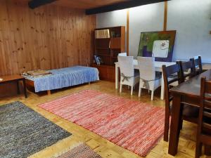 a living room with a table and a dining room at Idyllic house in beautiful area in Saxby