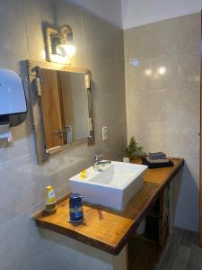 a bathroom with a white sink and a mirror at Casa Bella Vista 2 Modernes Ferienhaus in Bella Vista