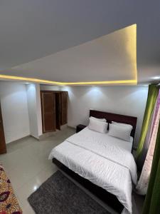 Rúm í herbergi á Apex guest facility