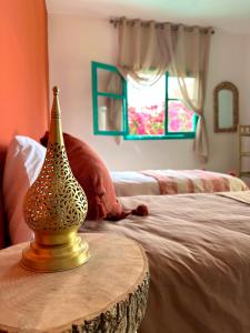 Postel nebo postele na pokoji v ubytování Dar Al-Andalus