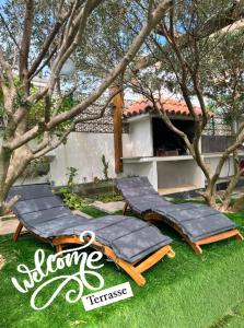 a group of lounge chairs sitting on the grass at Ferienhaus in Kroatien für 9 Personen in Maslenica
