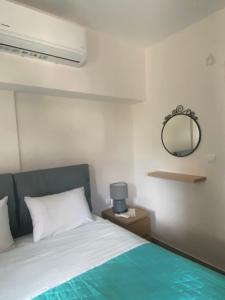 Postel nebo postele na pokoji v ubytování Οι Ακτινες Του Ηλιου