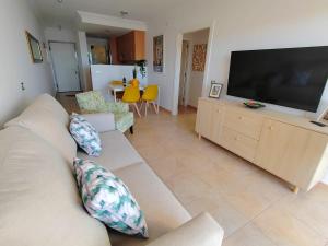 a living room with a couch and a flat screen tv at Casa Poris in Poris de Abona +39 photos
