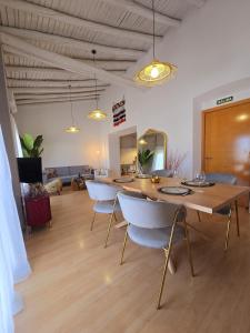 a room with a table and chairs in it at Urban Loft - La Conce in Cáceres