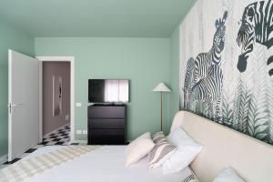 Ένα ή περισσότερα κρεβάτια σε δωμάτιο στο Jungle Apartment +21 φωτογραφίες
