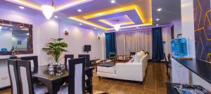 a living room with a couch and a table at Serene Hills Home in Nairobi
