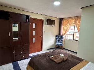 Postel nebo postele na pokoji v ubytování Hotel Casa Santa Lucía