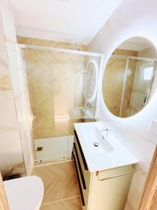 a bathroom with a sink and a shower at Luxury studio Torremolinos Costa del Sol in Torremolinos +19 photos