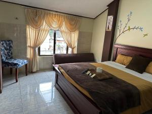 Postel nebo postele na pokoji v ubytování Hotel Casa Santa Lucía
