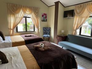 Postel nebo postele na pokoji v ubytování Hotel Casa Santa Lucía