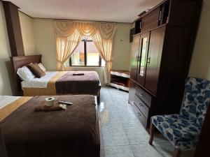 Postel nebo postele na pokoji v ubytování Hotel Casa Santa Lucía