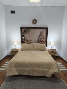 En eller flere senge i et værelse på Casa Rural hasta 14 personas Alpujarra Granadina, La Almazara