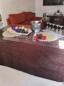 a table with a plate of food and drinks on it at Casa Rural hasta 12 personas Alpujarra Granadina, La Almazara in Mecina Fondales