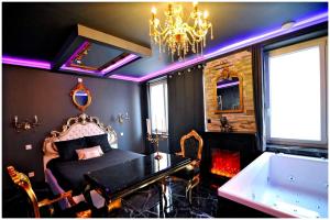 La majestueuse, SPA XXL, Day use, Suite de luxe, 5 min centre 객실 침대