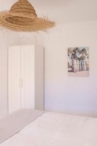 Giường trong phòng chung tại Atlantic Garden Beach & Surf 164