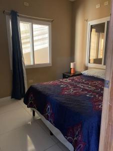 Postel nebo postele na pokoji v ubytování 5 minutos de UNITEC Apartamento completo de un cuarto